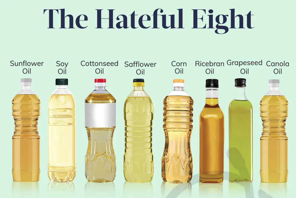 Eight bottles of different cooking oils are displayed with their labels: Sunflower Oil, Soy Oil, Cottonseed Oil, Safflower Oil, Corn Oil, Ricebran Oil, Grapeseed Oil, and Canola Oil. The title "The Hateful Eight" is above them.