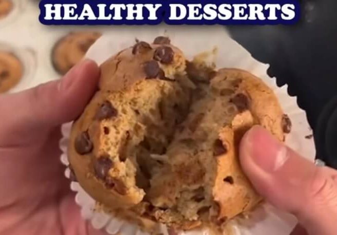 Hands break open a chocolate chip muffin, revealing its fluffy interior, with the text "HEALTHY DESSERTS" above.